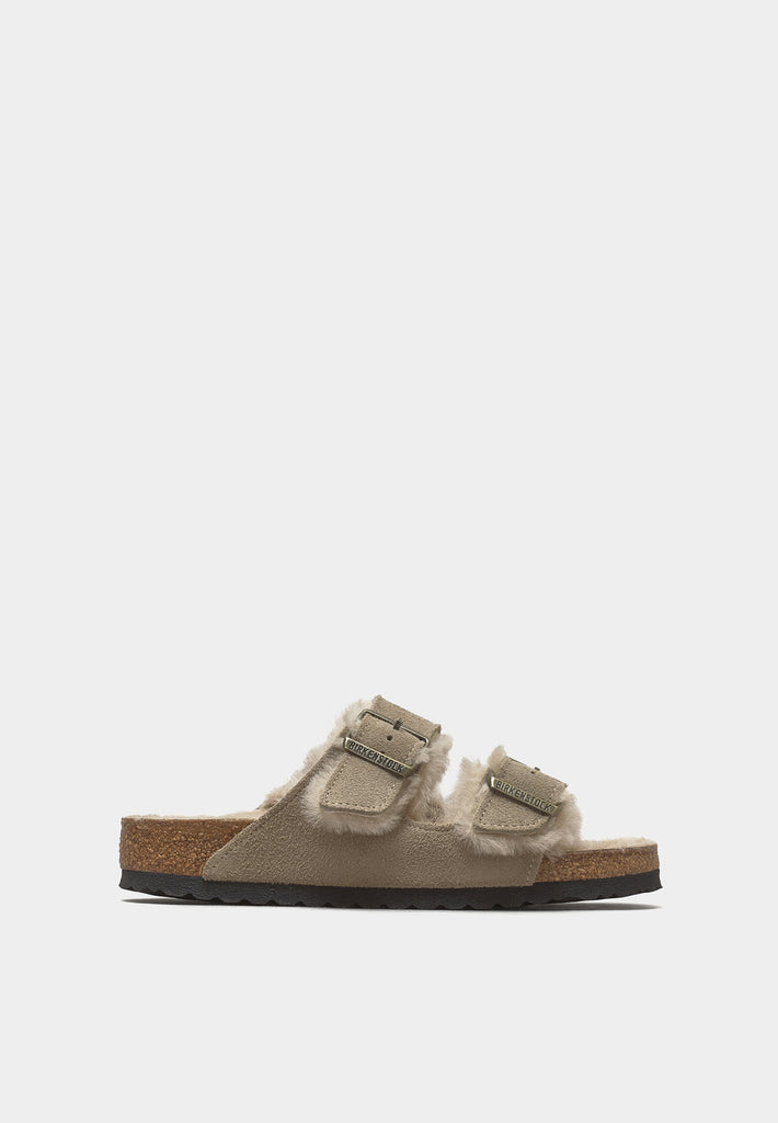 Side view of Birkenstock Arizona Taupe Shearling sandals with EVA sole and natural lining.
